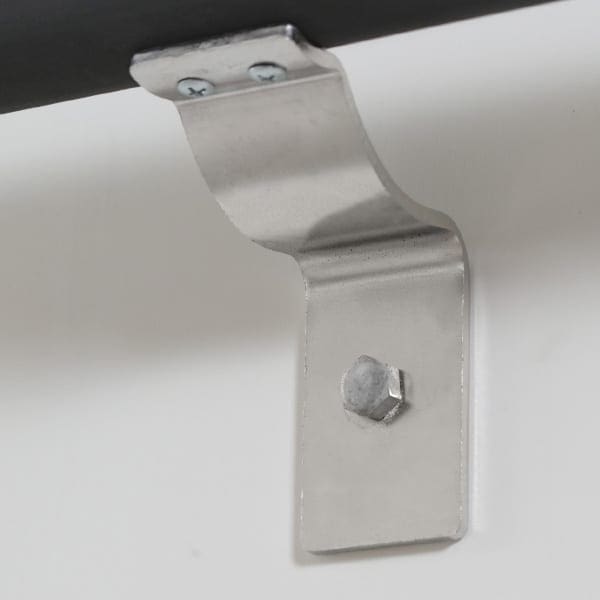 Silver FRP handrail bracket mounted on wall.