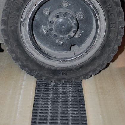 Image of automotive tire driving over PROGrid high load capacity FRP molded grating.