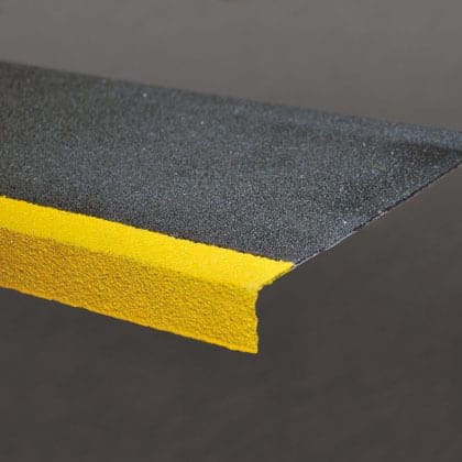 Image of grey and yellow Fiberglass Reinforced Plastic stair tread cover.