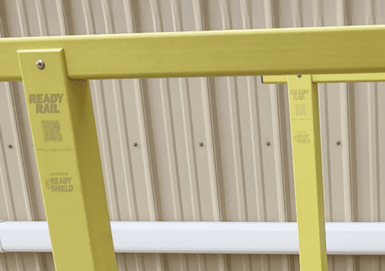 Close up image of Bedford's ReadyRail with zoomed in image of the yellow ReadyShield and a QR code