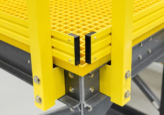 Yellow fiberglass reinforced plastic platform and guardrails.