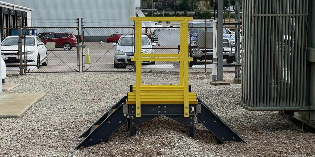 Crossover platform made from fiberglass-reinforced polymer in industrial setting.