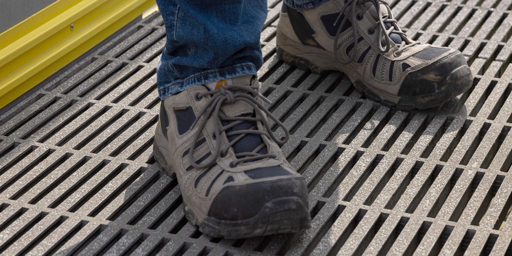 close-up of work boots standing on pultruded platform