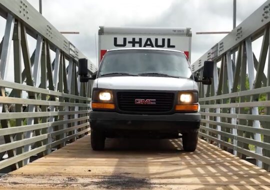 U-Haul driving over a fiberglass-reinforced polymer bridge